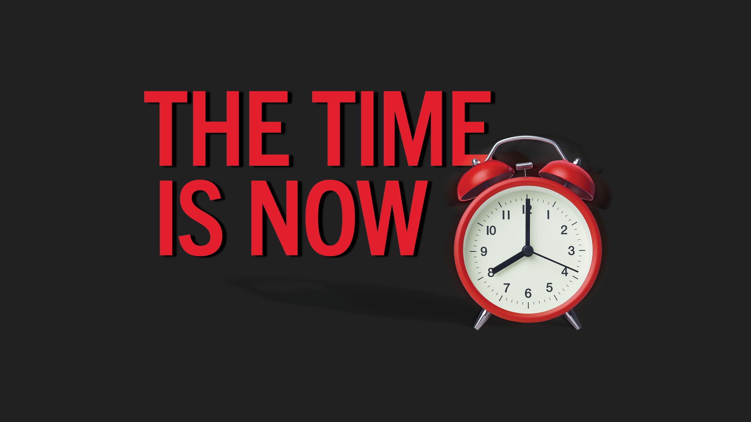 Bold red type appears to the left of the clock and reads,"The Time is Now".