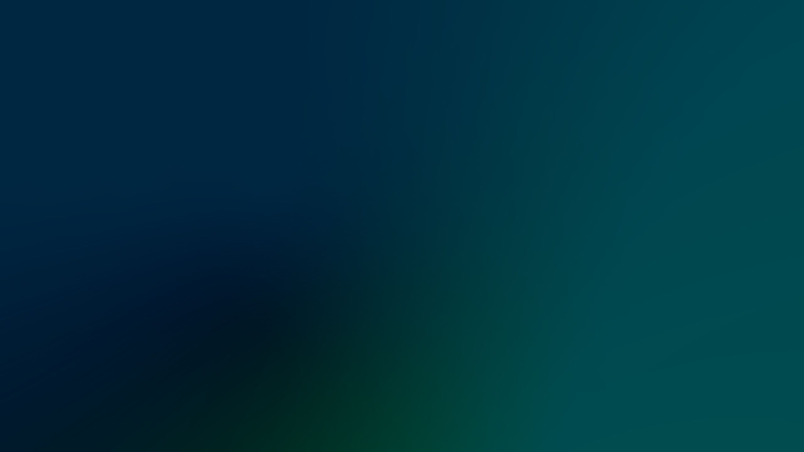 Image of a color gradient fading from deep blue in the top left to a medium teal at the bottom right. 