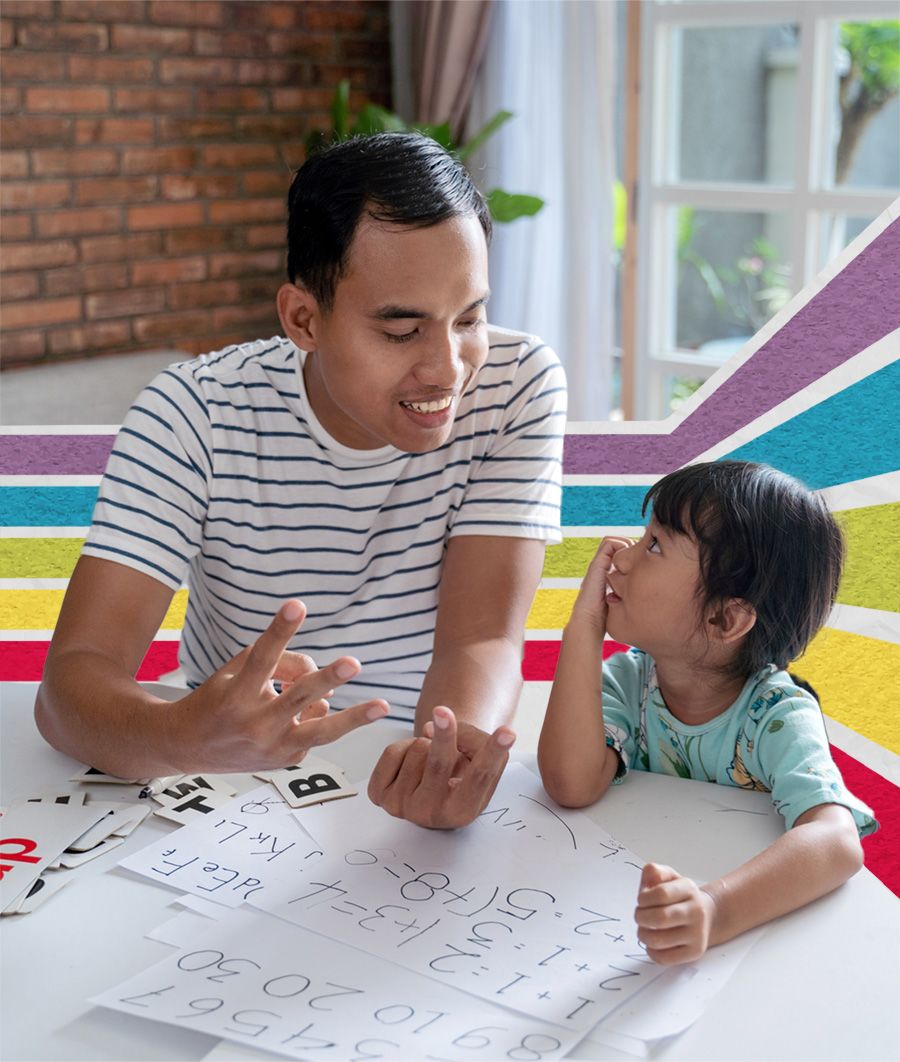 Father teaching his daughter math.