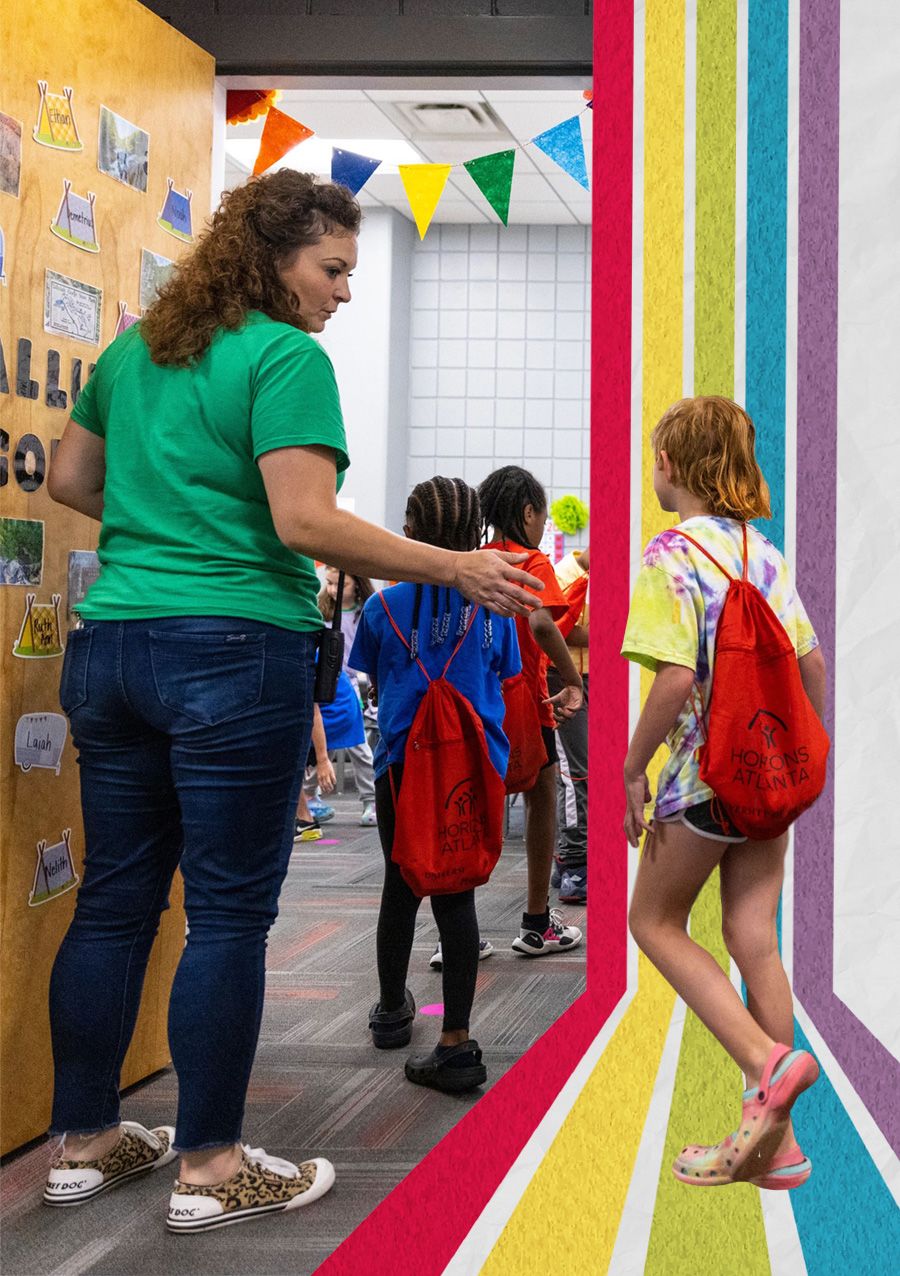Photo of an instructor with students at UGA Horizons summer camp.